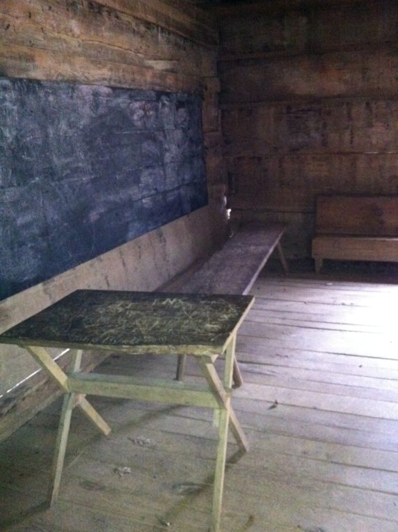 A true black board and the teacher's desk in the Greenbrier School